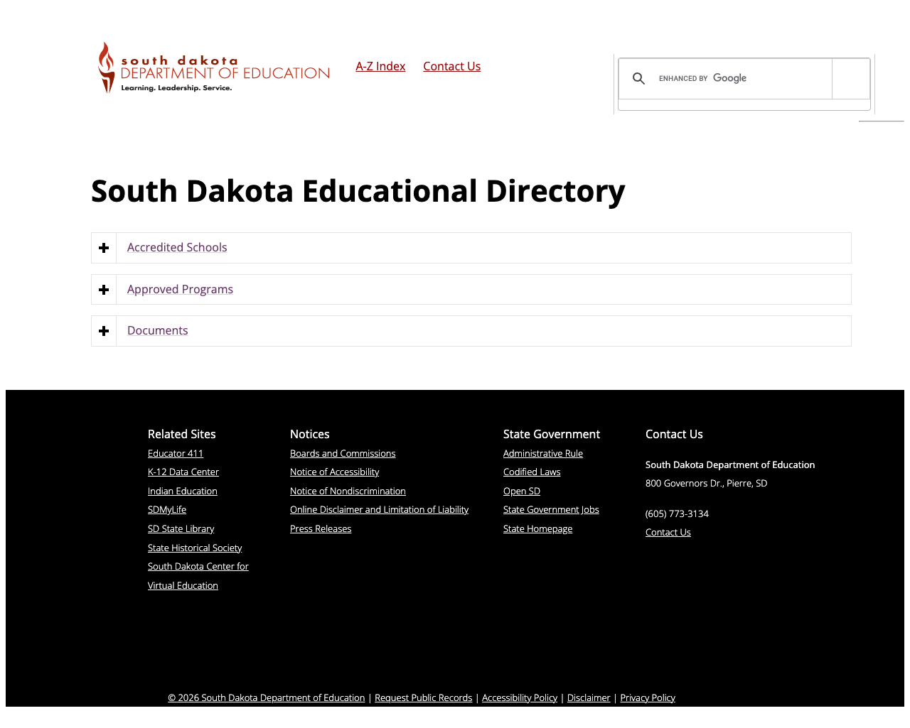 Screenshot: School Directory page showing different dark footer theme compared to rest of site